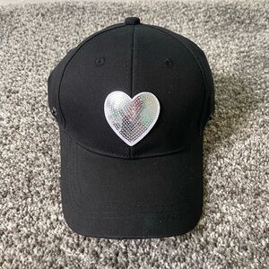 NWOT BLACK BASEBALL CAP WITH A SHINY SILVER HEART.